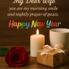 Romantic New Year Wishes Image with rose, candle and gift box on wooden table